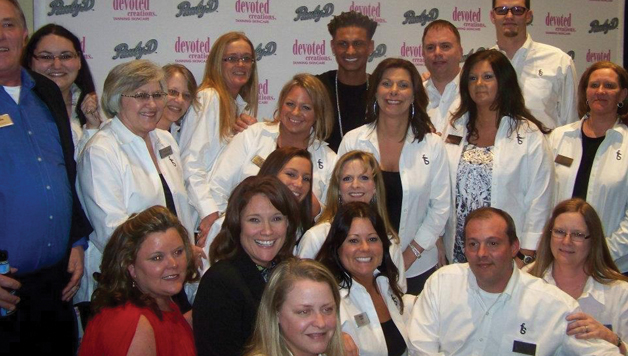 After 21 years with Team Four Seasons, Melissa (in black) says she's confident in her role in the tanning industry.